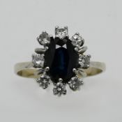 1 Damenring GG/WG 14ct. wohl mit ovalem Saphir 