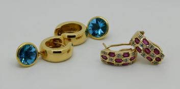 1 Paar Ohrringe GG 18ct. wohl mit je einem Blautopas, 