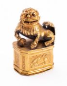 A small Chinese gold seal box and cover the sides embossed with two carp and two long-tailed birds,
