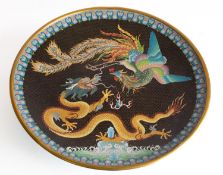 A large Chinese cloisonne 'dragon and phoenix' charger the dragon and phoenix on a black ground
