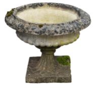 A stone composition garden urn, loosely in Aesthetic taste, probably by Haddonstone,