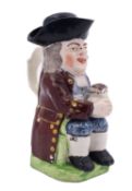 A 19th century Staffordshire toby jug and cover modelled holding a floral decorated foaming jug,