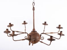 A wrought iron nine light chandelier in early 18th century taste;