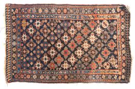 An Antique Qashgai mat, the indigo field with a diagonal stellar lozenge design,