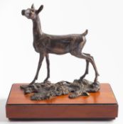 A patinated metal model of a doe, 'Fontainebleau', by Albany Fine China, modern; portrayed standing,