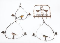 A pair of wrought iron and painted wood twin light chandeliers in north European folk art taste,