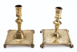 Two similar brass candlesticks, probably Spanish,