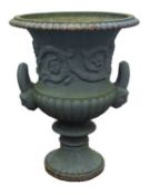 A painted cast iron twin handled garden urn,