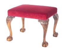 A carved mahogany beechwood frame rectangular stool in the George II manner,