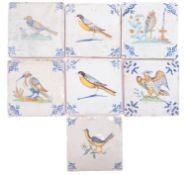 A group of seven Dutch delftware polychrome tiles painted with birds including an owl and an eagle,