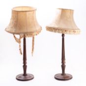 A pair of mahogany table lamps modelled as George III candlesticks,
