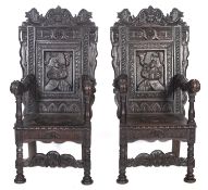 A pair of carved oak Wainscot armchairs in 17th century style,