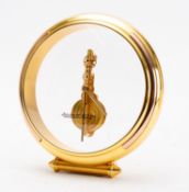 Jaeger-LeCoultre a circular gilt-brass and perspex mantel clock having an eight-day duration
