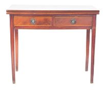 An early 19th Century mahogany and inlaid rectangular tea table, with a hinged top,