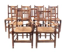 A set of nine oak and rush seated dining chairs, in Regency country taste,