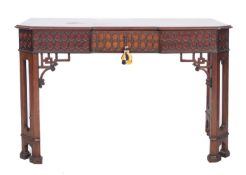 A mahogany inverted breakfront side table in 'Chinese Chippendale' taste,