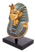 An enamelled bronze model of the death mask of King Tutankhamun, modern,