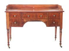 A George IV mahogany washstand/dressing table, with a three quarter ledge gallery,