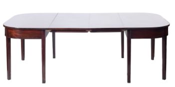 An early 19th Century mahogany D-end dining table, with three additional centre leaves,