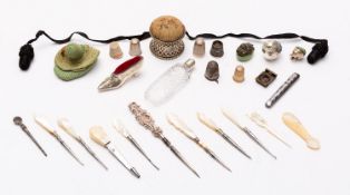 A collection of needlework and sewing accoutrements,