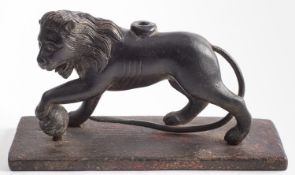 A Continental bronze model of a lion, in the manner of one of the Medici Lions,