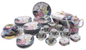 A Mottahedeh porcelain 'tobacco leaf' part dinner service in Chinese Export style,