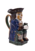 A Yorkshire pearlware toby jug decorated in Pratt colours, wearing a blue coat,