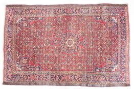 A Bidjar rug, the wine field with a central indigo pole medallion, all over flowerhead,