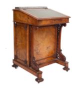 A Victorian walnut davenport, the superstructure with a lidded fitted stationery compartment,