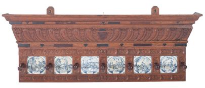 A 19th Century carved oak wall mounted hat and coat rack,
