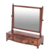 A George IV mahogany and inlaid swing frame platform toilet mirror, bordered with ebonised lines,