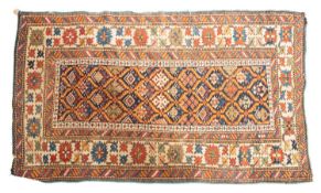 A Shirvan rug, the indigo trellis field with a design of serrated,