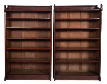 A pair of Aesthetic movement teak open bookcases, each with fixed shelves on plinth bases,