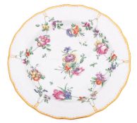 A Champion's Bristol plate painted with garlands of flowers suspended from gilt rings around a