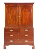 A George IV mahogany linen press,