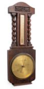 An oak wall barometer the round brass dial engraved with barometric markings and signed Jay's,