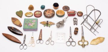 A collection of needlework and sewing accoutrements,