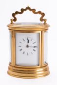 A French late-Victorian oval brass carriage clock the eight-day duration movement having a platform