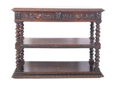 A Victorian oak buffet, circa 1880; the top with carved and moulded edges,