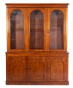 A Victorian mahogany library bookcase, the upper part with a moulded cornice,