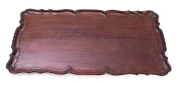 A Sheraton-style inlaid mahogany oval tray and a Georgian-style tray with 'pie-crust' edge,