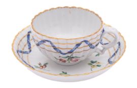 A Champion's Bristol teacup and saucer from the Countess Nelson service of fluted form,