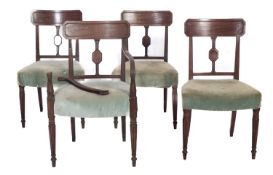 A set of four Regency mahogany and inlaid dining chairs in the manner of Gillows,