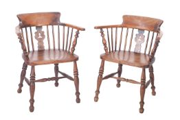 A pair of Victorian elm, ash and fruitwood Windsor elbow chairs, probably Thames Valley,
