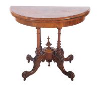 A Victorian walnut and inlaid half round card table, bordered with boxwood lines,