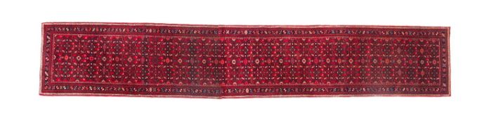 A Malayer runner, the wine field with all over geometric designs,