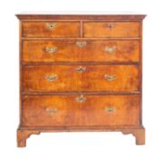 An early 18th Century walnut, crossbanded and feather strung rectangular chest,