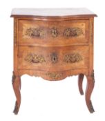 A French walnut, crossbanded and gilt meal mounted serpentine fronted petit commode,