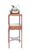 A George III mahogany washstand, last quarter 18th century; the top with circular aperture,