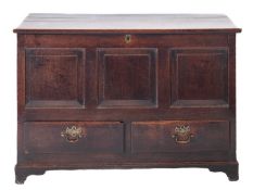 An 18th Century oak dower chest, with a plain rectangular hinged moulded top,